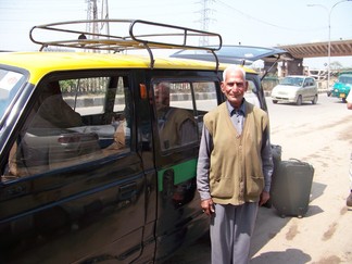 Cab and driver, New Delhi, India.