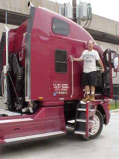 Don on stairs to tractor.