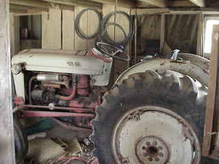 Tractor in barn.