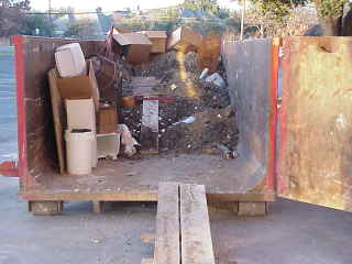 Partially full dumpster.